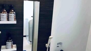 Plum Ark Apartment 205 | Bathroom | Separate tub and shower, deep soaking tub, free toiletries, hair dryer