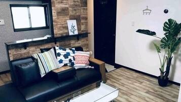 Plum Ark Apartment 205 | Living area | Flat-screen TV