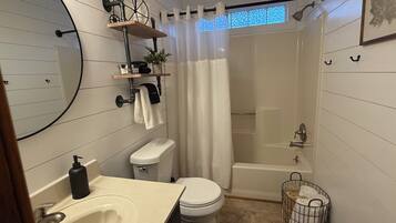 Combined shower/tub, hair dryer, towels, soap