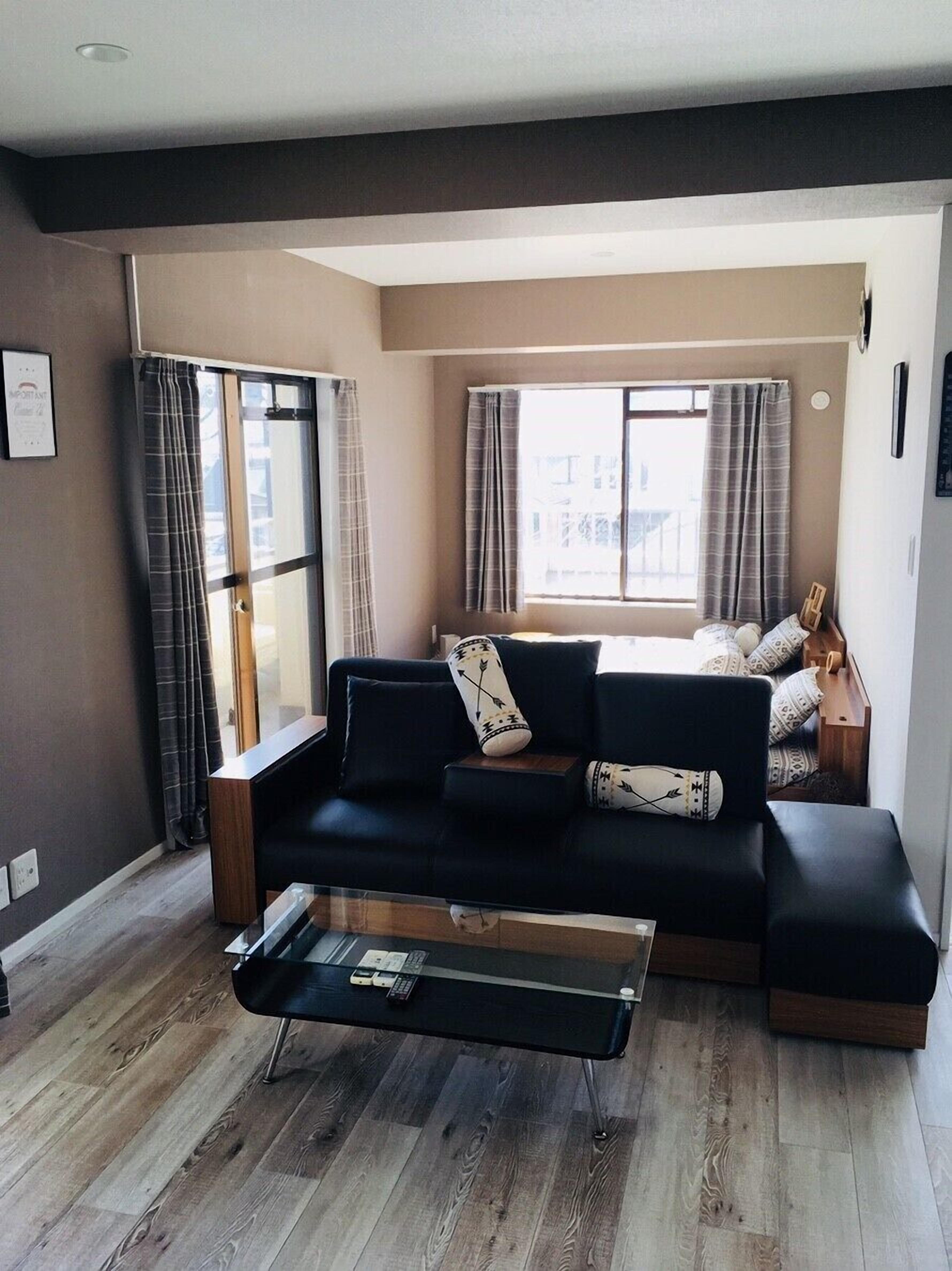 Plum Ark Apartment 402 | Living area | Flat-screen TV