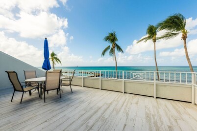 Ocean Front Paradise Seven Mile Beach Sunsets!