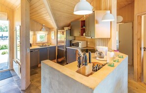 Fridge, stovetop, dishwasher, coffee/tea maker