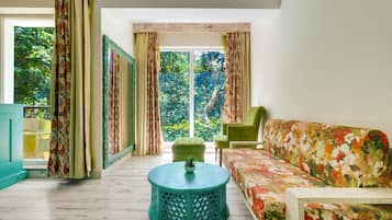 Suite, Balcony | Living area | 28-inch LED TV with digital channels, TV