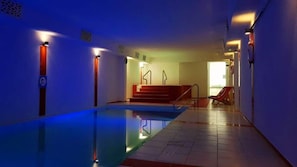 Indoor pool, open 11:00 AM to 10:00 PM, pool loungers
