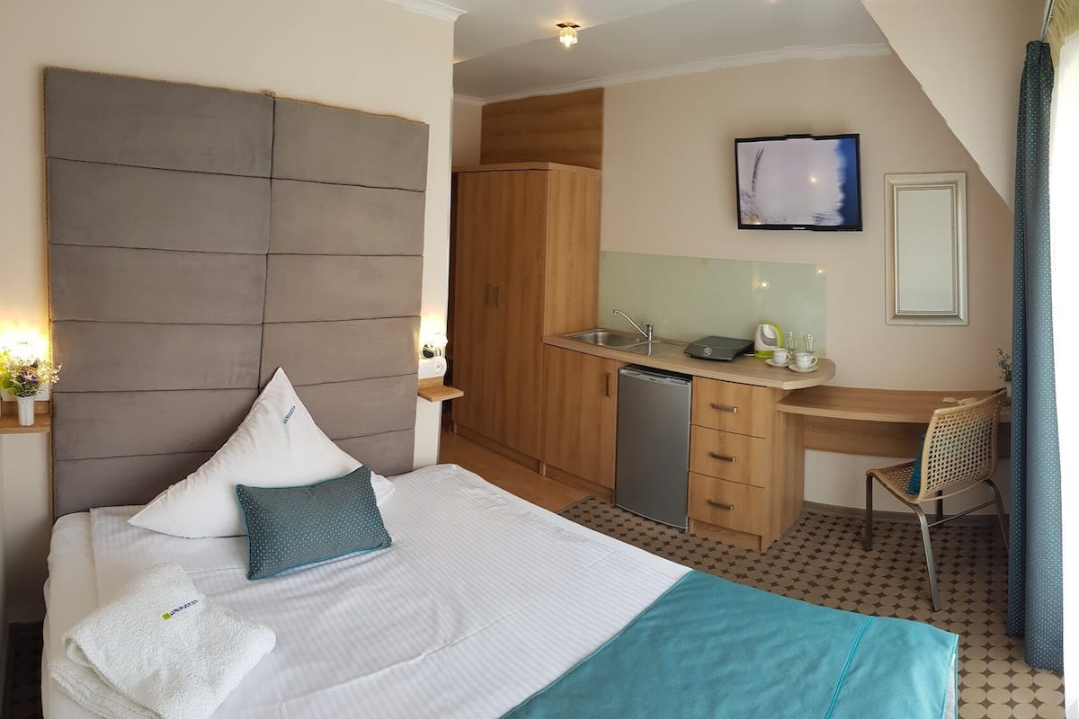 Economy Double Room, Pool Access | Living area | 40-inch flat-screen TV with satellite channels, TV, heated floors