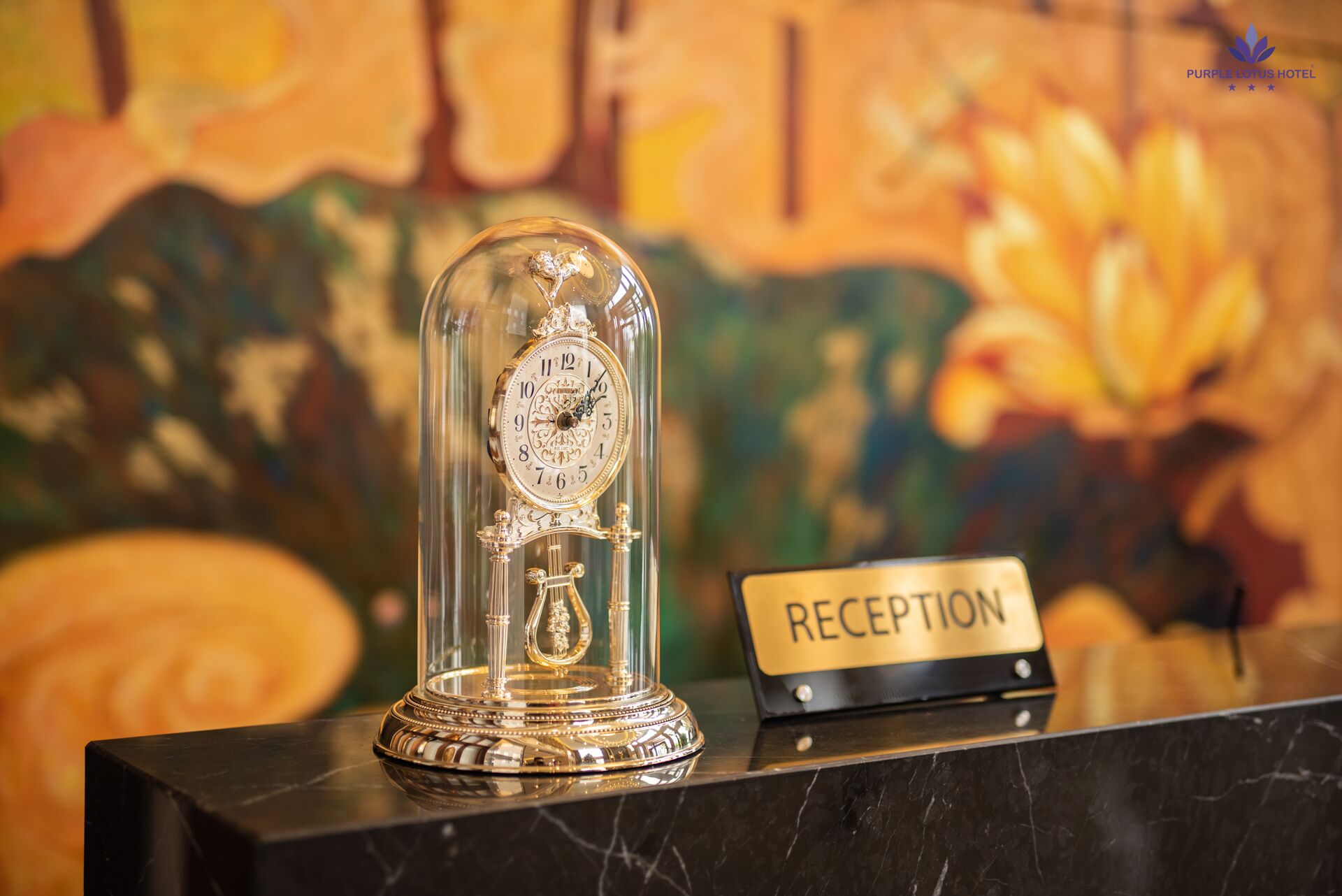 A reception desk with a glass dome clock and a sign labeled "RECEPTION".