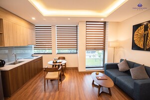 Apartamento junior | Zona de estar | Una televisión de pantalla plana