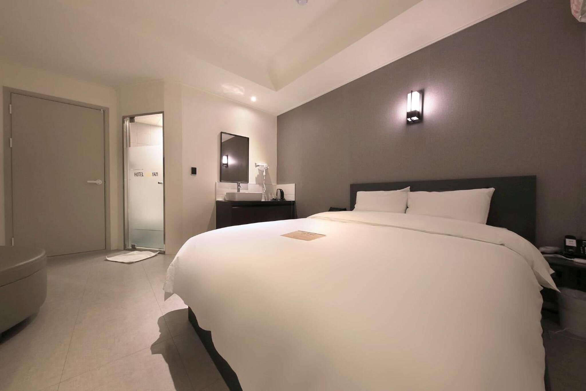 Premium bedding, desk, laptop workspace, blackout curtains