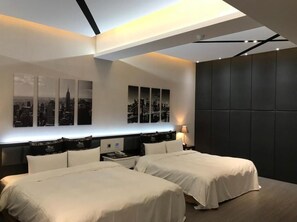 A modern hotel room with two beds, a cityscape view, and a dark accent wall. - Kai-Hong Motel (Taoyuan City)