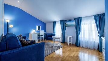 Deluxe Apartment, Sea View (301) | Minibar, in-room safe, desk, blackout drapes