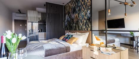 Deluxe Studio, 1 Queen Bed, Non Smoking, Balcony | Living area | 40-inch flat-screen TV with cable channels, TV