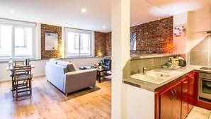 A modern apartment with a living room, dining area, and kitchen. - LE ROSA BONHEUR - One Bedroom Apartment, Sleeps 4 (Toulouse)