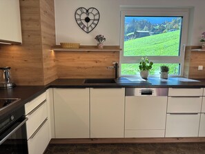 Apartment, 4 Bedrooms, Balcony (incl. Cleaning Fee 150€) | Private kitchen | Fridge, microwave, oven, stovetop - Appartementhaus Zillertal (Finkenberg)