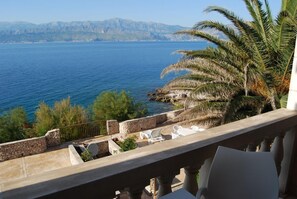1 - Room Apartment with Front- Balcony and Sea View | Living area | 58-inch flat-screen TV with satellite channels, TV, table tennis - Apartmenthaus Punta (Supetar)