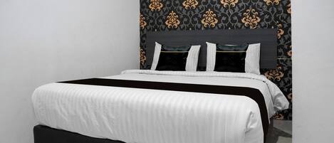 Suite Deluxe | Escritorio, insonorización, wifi gratis y ropa de cama
