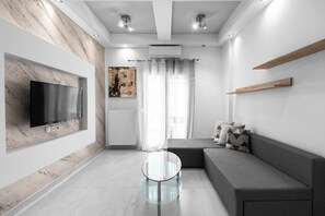 Apartment, Stadtblick (101) | Wohnbereich | Flachbildfernseher