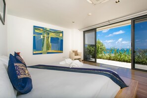 A modern bedroom with a large bed, a view of the ocean, and a piece of abstract art on the wall. -  The Heights Penthouse Ocean view A11 Near Kata Beach (Karon)