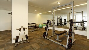 A gym with weightlifting equipment, exercise balls, and a mirror. - The heights B18 Seaview near Kata Beach (Karon)