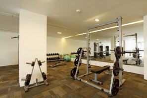 A gym with weightlifting equipment, exercise balls, and a mirror. - The heights B18 Seaview near Kata Beach (Karon)