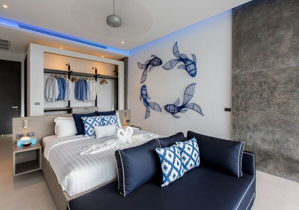 Un dormitorio moderno con cama, mesitas de noche, armario y decoración mural.
