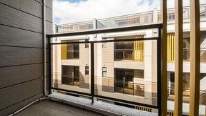 A modern building with a balcony and large windows. - Yilan Siao Jhu (Jiaoxi)