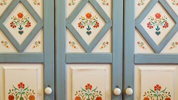 A set of doors with floral designs and heart motifs.