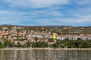 A coastal town with buildings along the waterfront. - Apartment Cherry (Crikvenica)