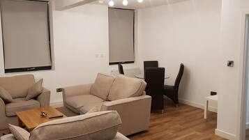 Two Bedroom Apartment | Living room | Flat-screen TV