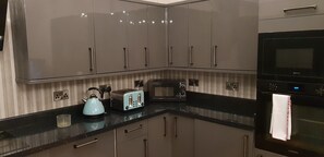 Two Bedroom Apartment | Private kitchen | Full-size fridge, microwave, oven, stovetop