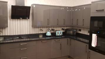 Two Bedroom Apartment | Private kitchen | Full-size fridge, microwave, oven, stovetop
