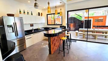 Full-sized fridge, microwave, stovetop, coffee/tea maker