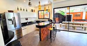 Full-sized fridge, microwave, stovetop, coffee/tea maker