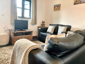 Een smart-tv, een dvd-speler en boeken