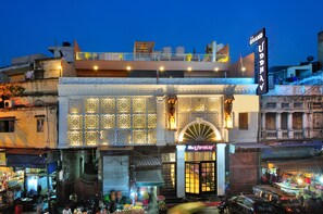 A building with a sign reading "The Grand Udhav." - Hotel Grand Uddhav (New Delhi)