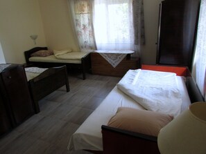 Classic Room, 3 Twin Beds, Private Bathroom (A) | Individually decorated, desk, laptop workspace, blackout drapes