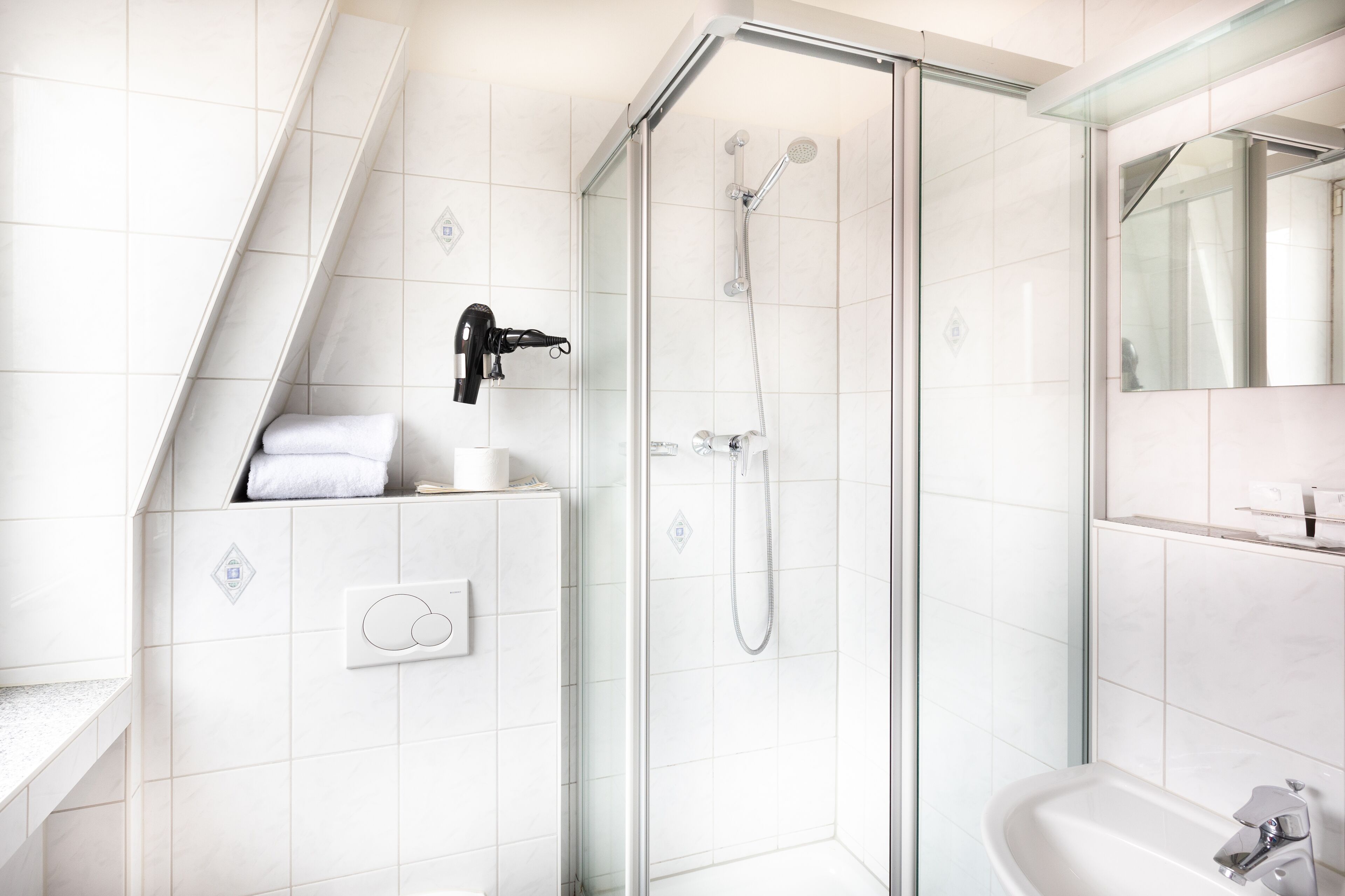 standard single room | bathroom | shower, hair dryer, towels, soap