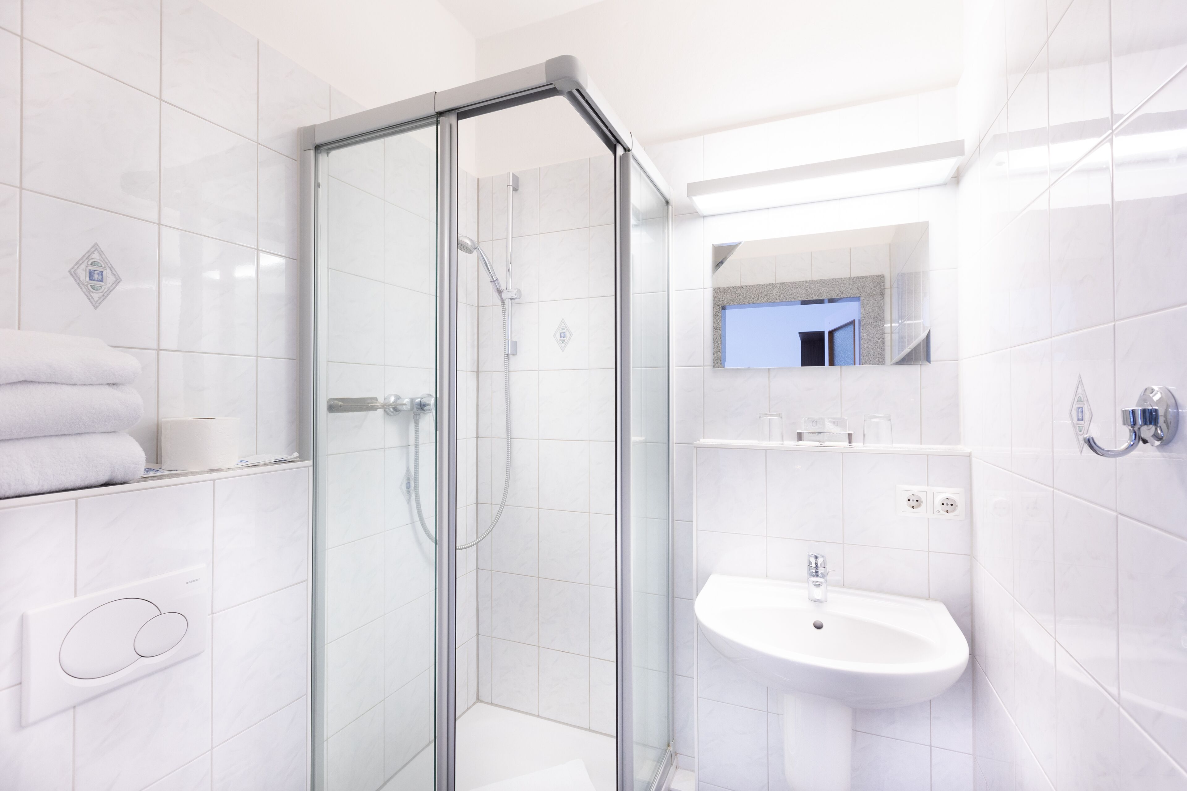 standard double or twin room | bathroom | shower, hair dryer, towels, soap