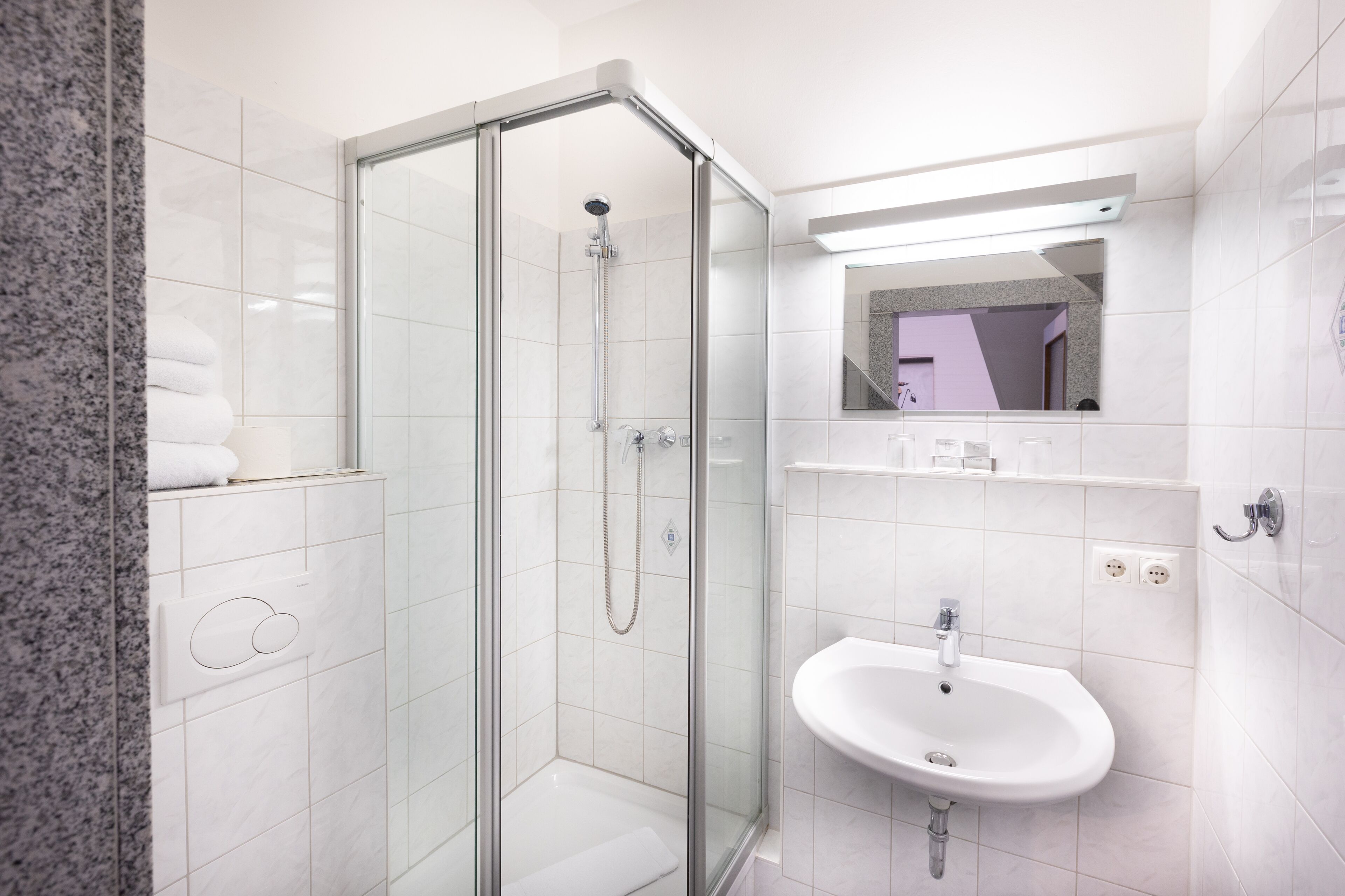 standard triple room | bathroom | shower, hair dryer, towels, soap
