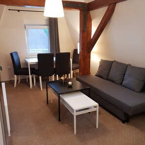 Familienzimmer (4) | Wohnbereich | Flachbildfernseher