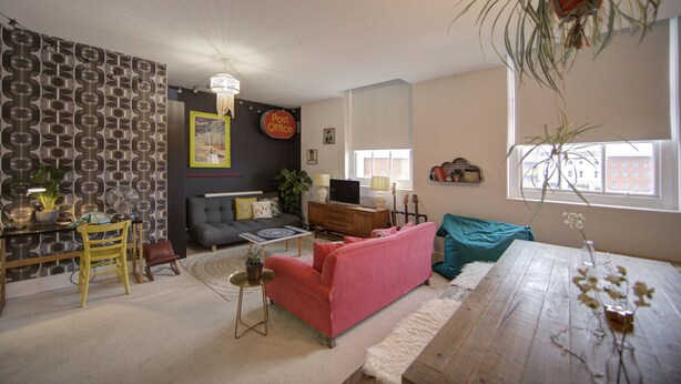 A living room with a sofa, a dining table, and a TV. - Old Town Grade II Listed 2 Bed (Margate)