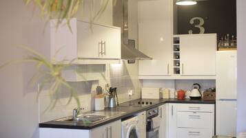 Apartment, 2 Bedrooms | Private kitchen | Full-sized fridge, oven, stovetop, coffee/tea maker