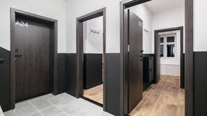 A hallway with doors labeled A24 and A22, leading to rooms. - Pytloun Flat Hotel (Liberec)