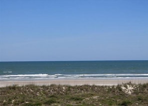 A beach with a clear sky and ocean waves. - Hibiscus B203 (St. Augustine)