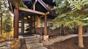 A wooden building with a porch, stone steps, and a wooden fence. - Prospector Studio - Slps 4 (Park City)