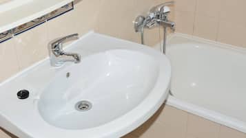 Bathtub, hair dryer, towels