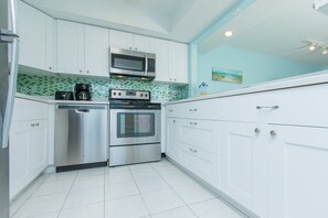 Condo, Multiple Beds, Balcony, Garden View | Private kitchen | Fridge, microwave, stovetop, dishwasher