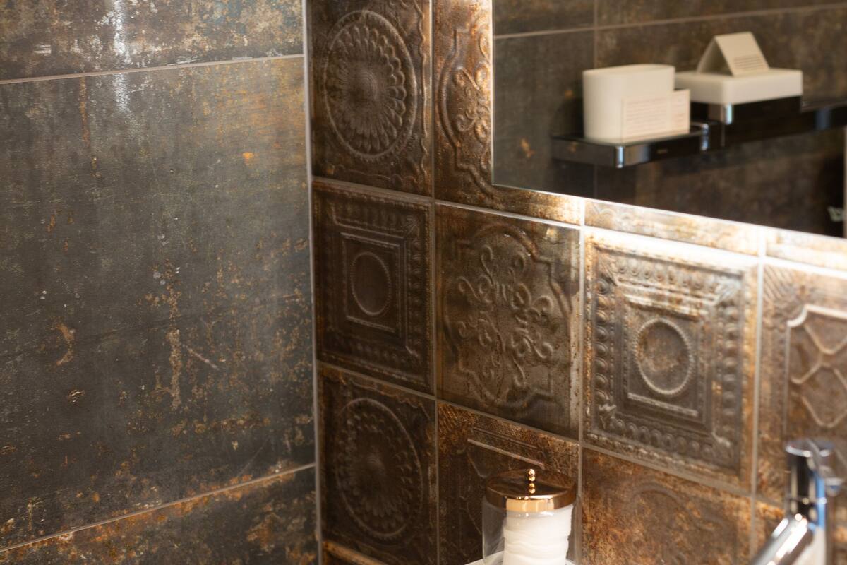 luxury suite | bathroom | designer toiletries, hair dryer, bathrobes, slippers