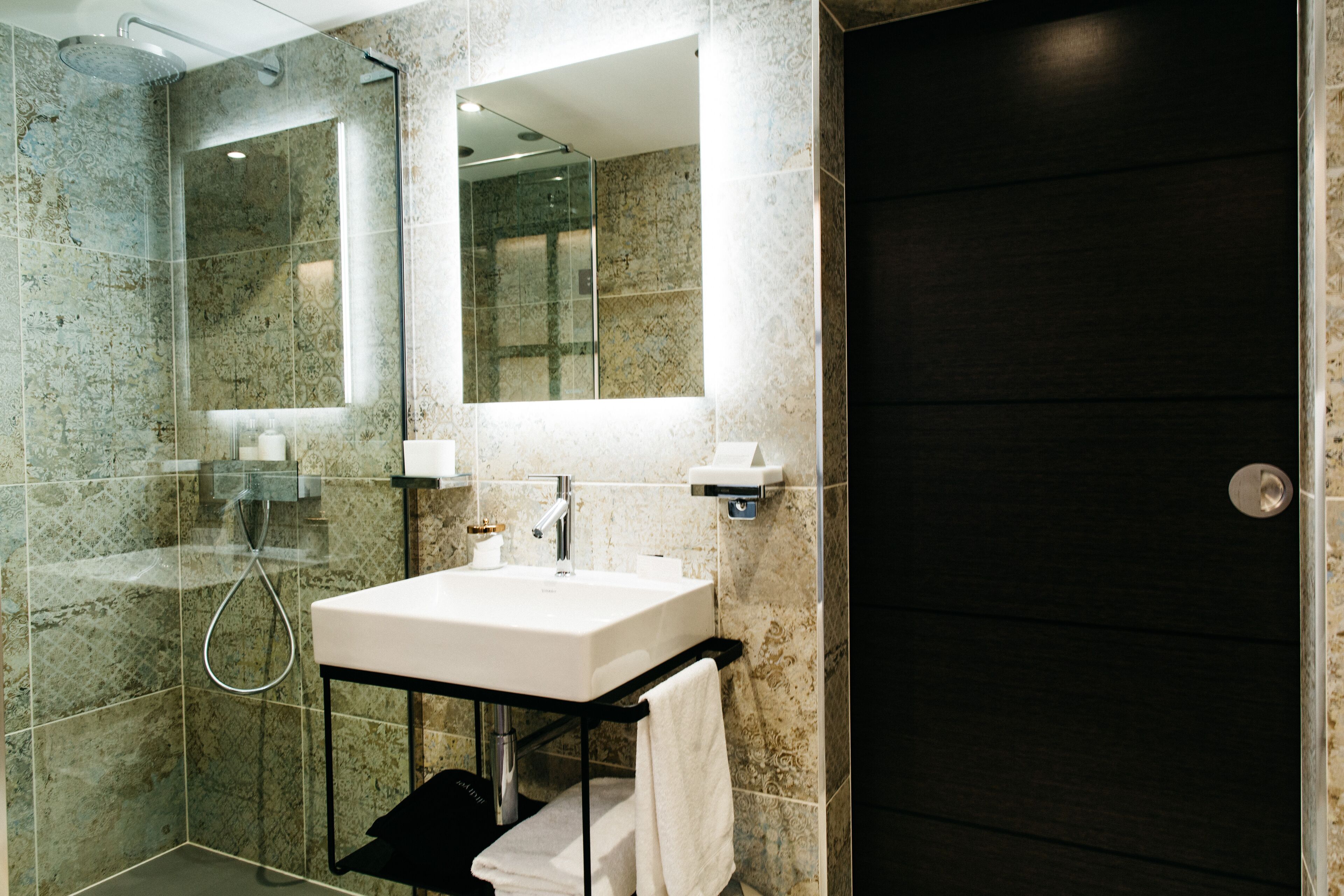 deluxe room | bathroom | designer toiletries, hair dryer, bathrobes, slippers