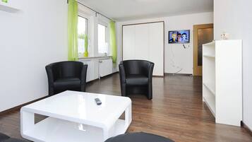 Apartment, 1 Bedroom (Lulu Meinders) | Living room | Flat-screen TV