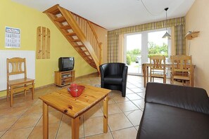 Family Apartment, 2 Bedrooms (Norderney) | Living area | Flat-screen TV - Reiterhof Maack (Neuharlingersiel)